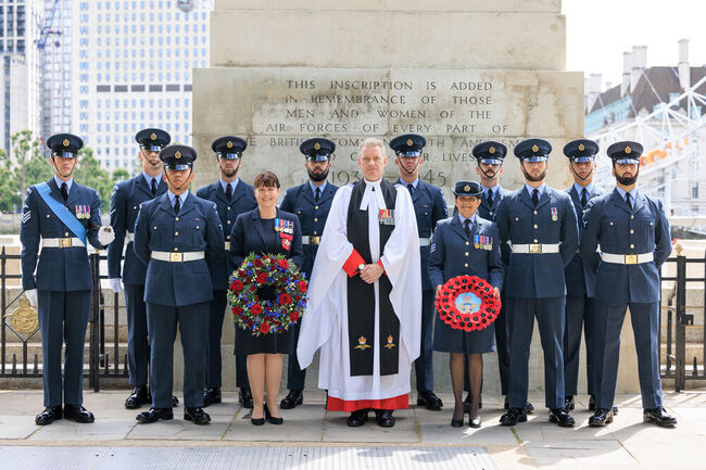 Chaplain, Air Vice-Marshal and King's Colour Squadron in front of memorial