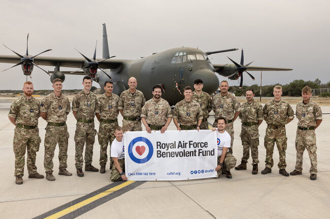 Troops in front of Hercules plane