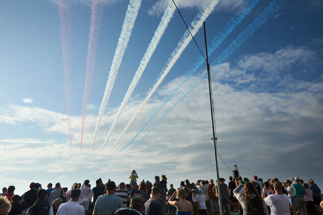 Red Arrows colours in sky above crowd