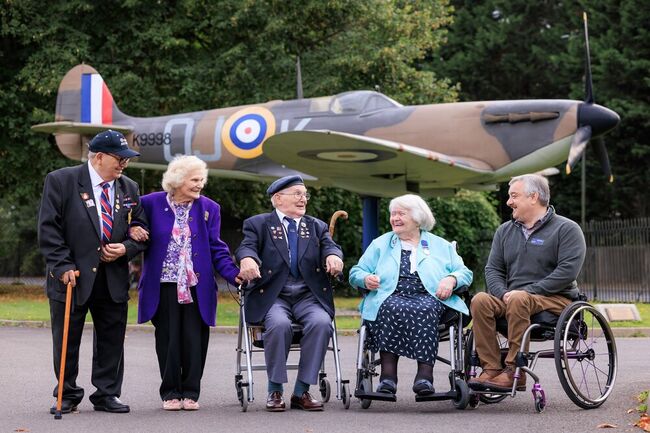 Veterans gather in front of Spitfire display at Biggin Hill