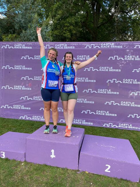 Elizabeth and Molly celebrating on the podium