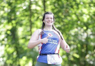 Elizabeth running and smiling in Fund branding