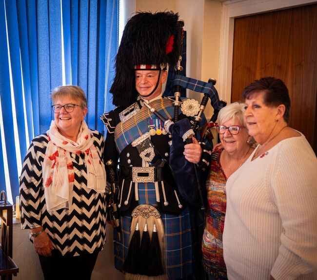 Group of veterans with the piper