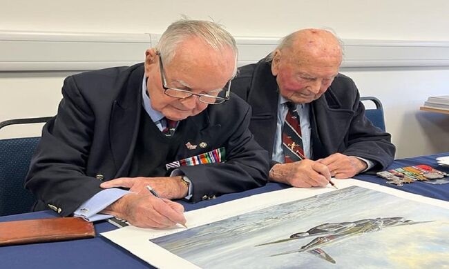 Colin and George signing aircraft print