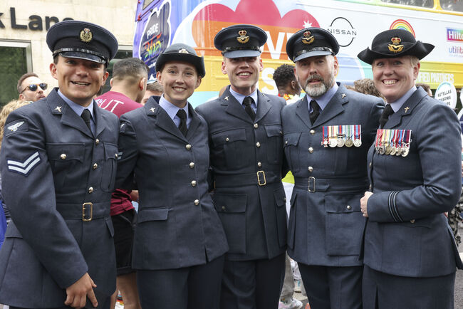 Members of RAF pose in uniform at Pride march
