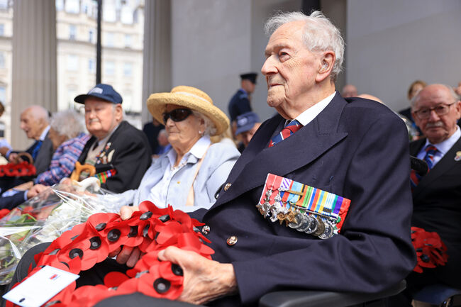 John Bell at Bomber Command Memorial 2022 holding poppy wreath