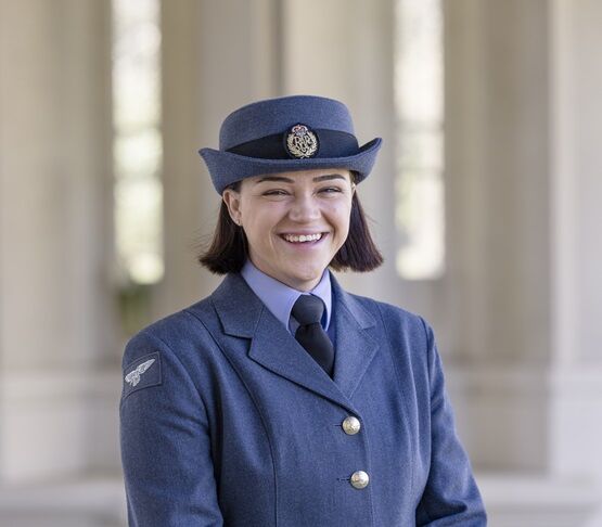 Demi in uniform smiling