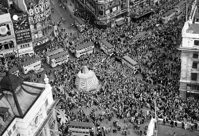 An aerial view of crowds gathering in Piccadilly Circus, London, on VE Day, 8 May 1945.