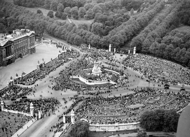 An aerial view of crowds gathering in outside Buckingham Palace on VE Day, 8 May 1945.