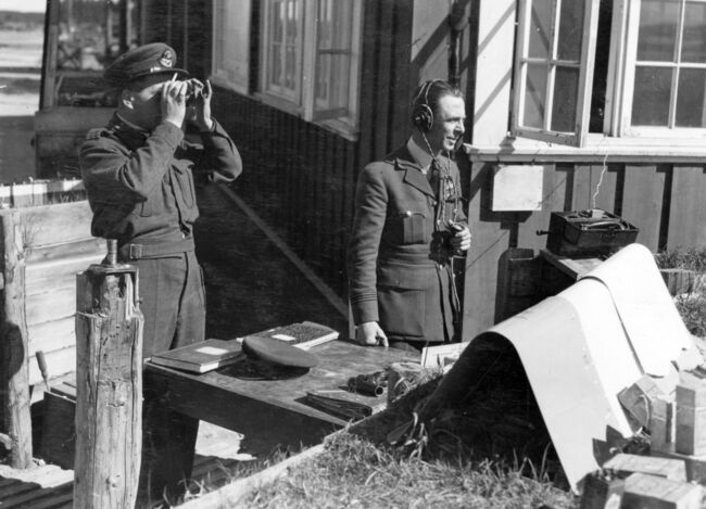 Two flying control officers - Flight Lieutennts M MacIntyre and H Summerscales - controlling RAF supply operations into Gerdermoen airfield, near Oslo, Norway, in mid-May 1945.  Over 600 Allied aircraft were safely brought in to the airfield during the early days of Operation DOOMSDAY, the liberation of Norway.