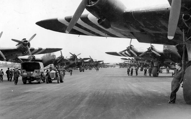 Operation TONGA. Short Stirling Mark IVs of Nos. 196 and 299 Squadrons RAF, lining the runway at Keevil, Wiltshire, on the evening of 5 June, before emplaning paratroops of the 5th Parachute Brigade Group for the invasion of Normandy.