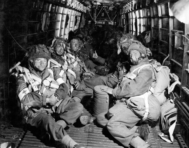 Operation TONGA: Faces blackened as part of their camouflage, Field Ambulance Paratroops on board their aircraft at Keevil airfield, Wiltshire, on 5 June 1944 ready to take part in the opening phase of the Normandy campaign, Operation TONGA.