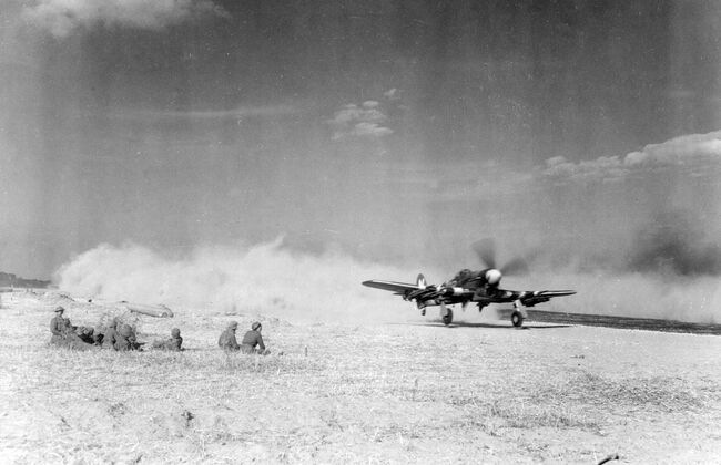 A Hawker Typhoon IB of 184 Squadron, MN529/BR-N, piloted by Flying Officer Ian Handyside, kicks up the dirt as it accelerates for take-off from the forward airstrip at B2/Bazenville, Normandy, on 14 June 1944. The dust played havoc with the Typhoon's already unreliable Sabre engines and it would only take a few days for large portions of aircraft to be grounded due to unserviceability.