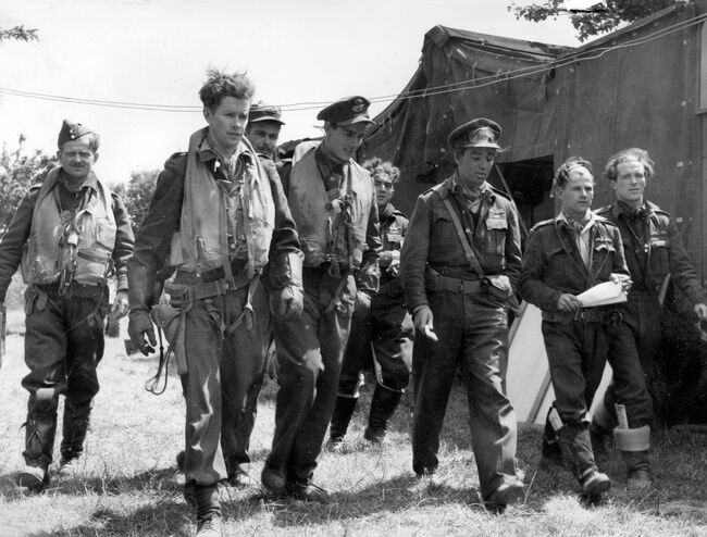 Hawker Typhoon pilots of 181 Squadron leave the briefing tent at B2/Bazenville, for a midday sortie over the Normandy battlefield on 17 June 1944.