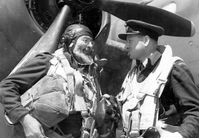 Ernest Hemingway, famous American author and journalist turned war correspondent to the Allied Expeditionary Air Force (AEAF), talking to Wing Commander LA Lynn DSO DFC, of Witbank, S. Africa, the Dunsfold Wing Leader. before a sortie against a "Noball" target in the Pas de Calais during the afternoon of 20 June 1944. Although only 28 at the time, Lynn already had 85 operations to his name.