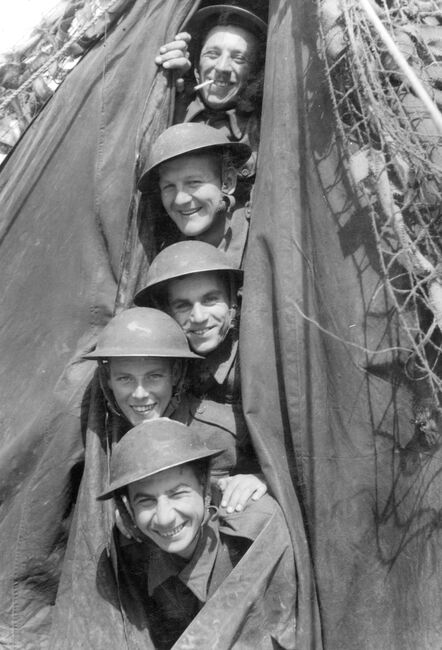 Members of an RAF Regiment anti-aircraft gun crew in their tent at an airfield in Normandy, 22 June 1944. From top to bottom: Leading Aircraftsman Davis, Sergeant Thornbert and LACs C Budgeon, Samson and Speake.