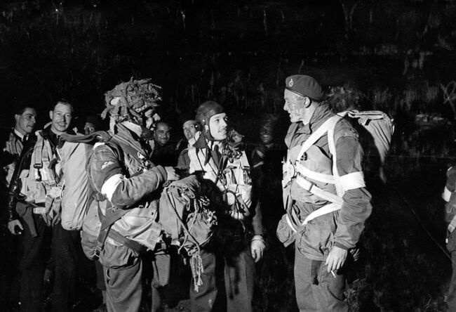Paratroops of the 5th Parachute Brigade Group wait nervously in the dark at Keevil airfield in Wiltshire on 5 June 1944 before emplaning their respective aircraft to take part in operation TONGA, the opening phase of the invasion of Europe.