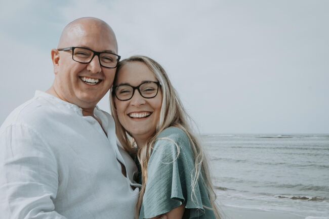 Matt and wife on beach smiling