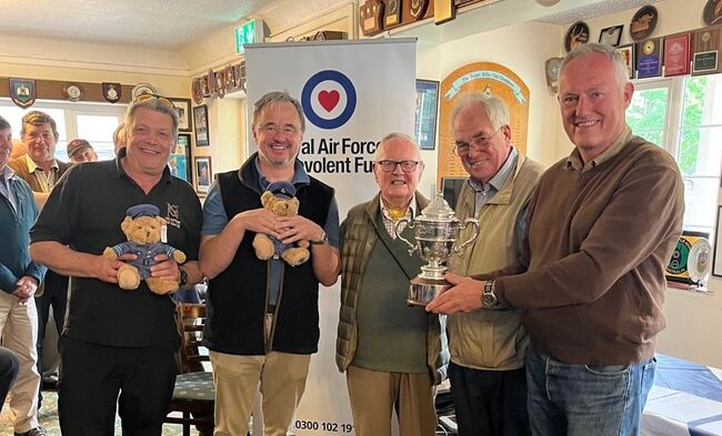 Carpenters Team holding their Winner's cup at the Inter-livery Rifle Shoot