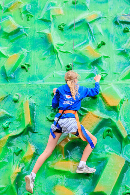 Girl on climbing wall