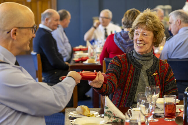 RAF veterans pulling Christmas crackers