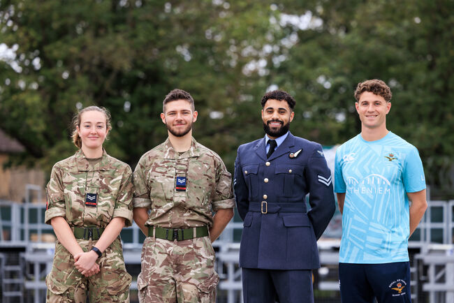 4 personnel in uniform smiling