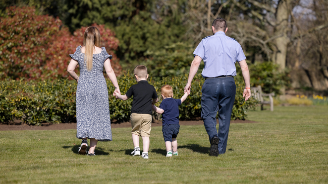 Family walking together on grass