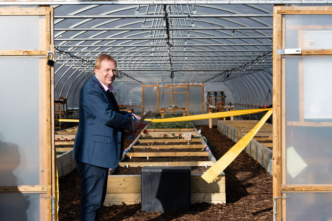 Simon cutting the ribbon at RAF Northolt polytunnels