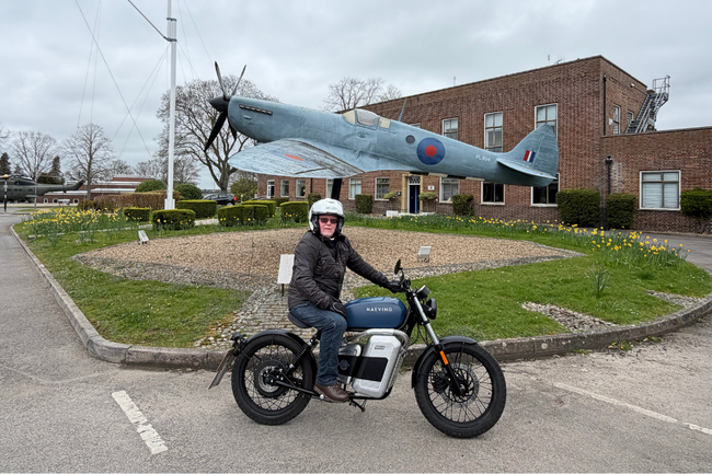 Tony in front of spitfire on his motorbike