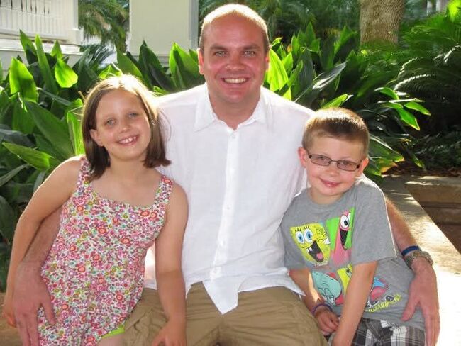 Amelia and her brother as children with her dad