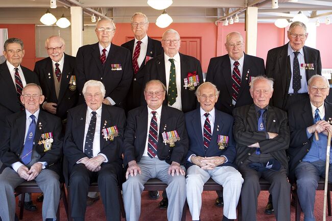 Veterans sat and stood together 