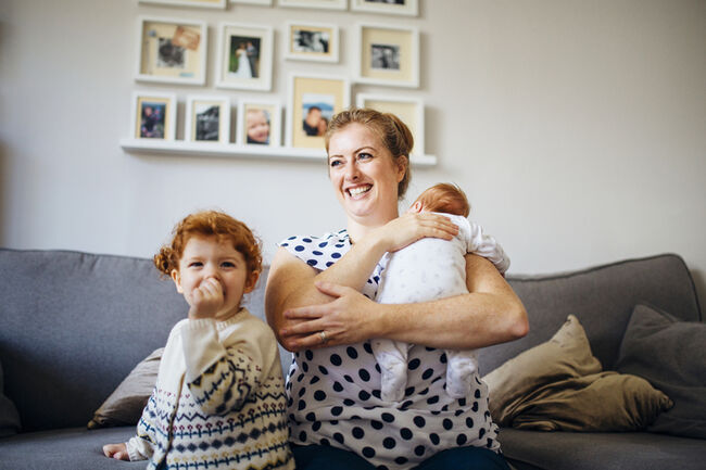 Mum and baby and toddler on sofa