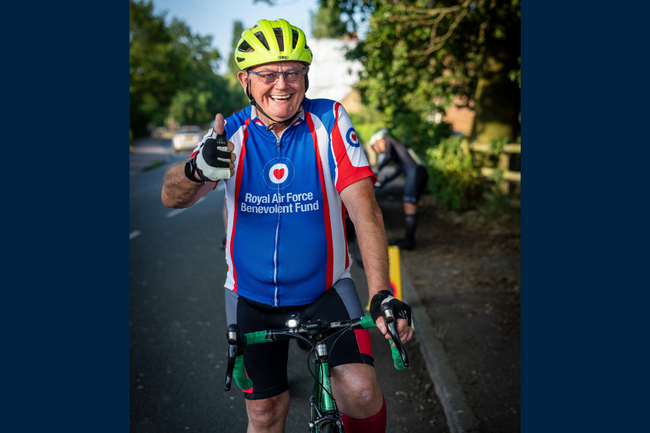 Des in Fund shirt on bike smiling