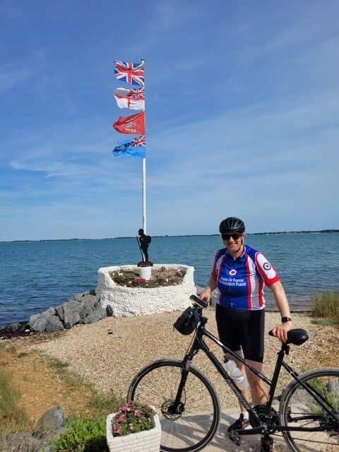 Ashleigh with bike in front of sea
