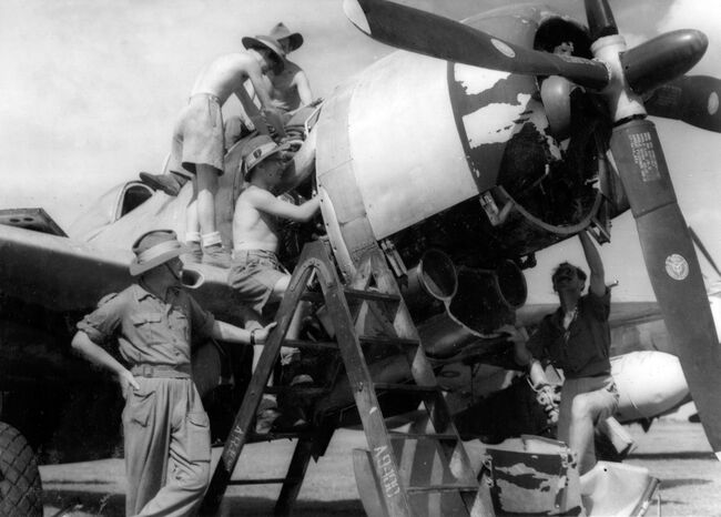 Groundcrew of 81 Squadron service a Republic Thunderbolt II fighter at Kemajoran/Batavia, in readiness for operations against Indonesian nationalists at Sourabaya in Java, in November 1945.