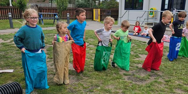 Lossie children playing sack race