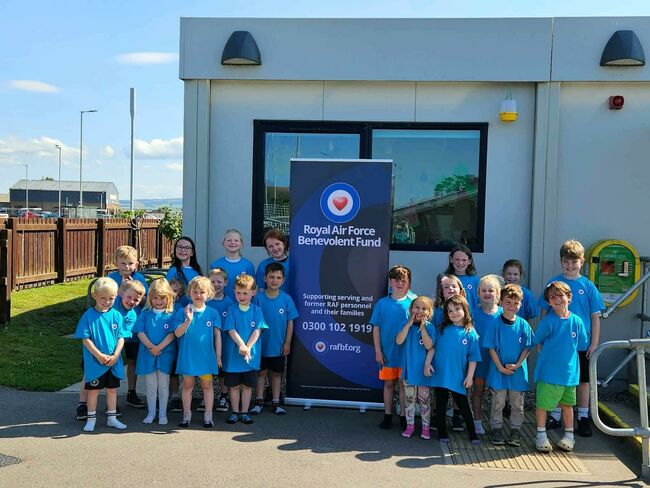 Children at Lossie in Fund blue tshirts